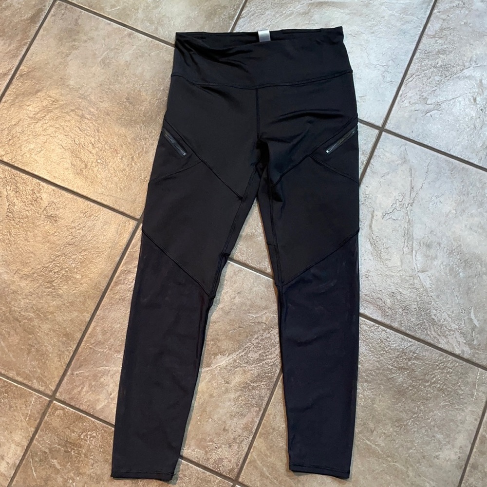 Ivivva black leggings with mesh bottoms. Excellent condition